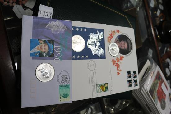 Three first day cover coins and an album and other first day covers